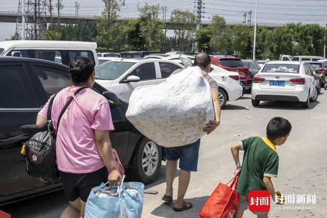 洪水围城｜新一轮降雨将至，河南卫辉城区8.6万人紧急转移